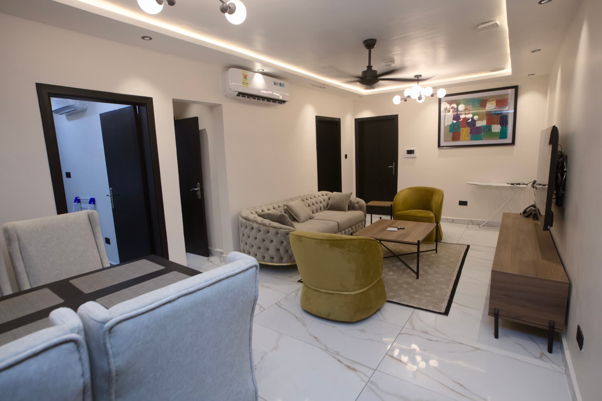 Amber Suite living room with a grey sofa and mustard armchairs
